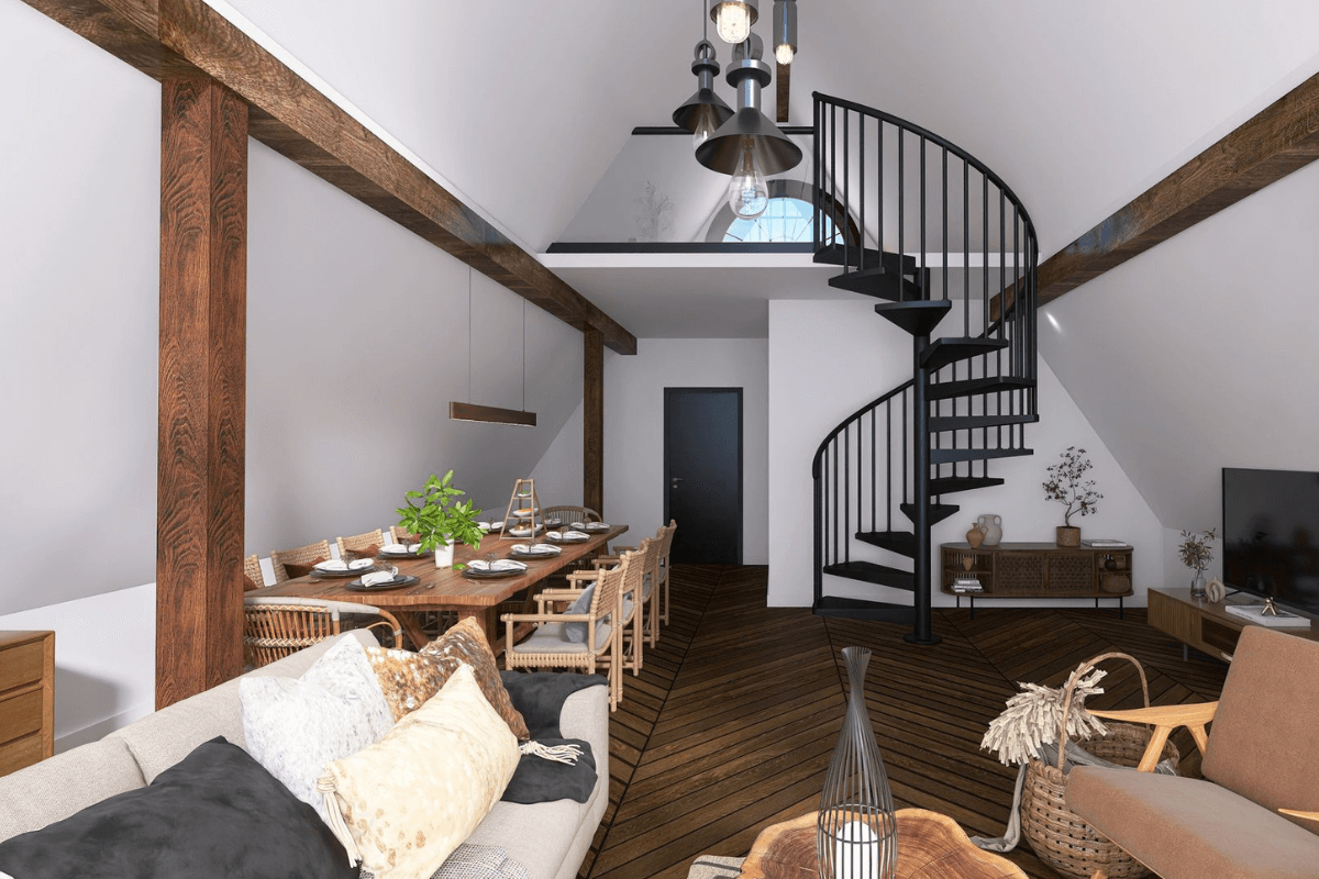 Wnętrze z spiralnymi schodami, drewnianym stołem i nowoczesnymi lampami w stylu industrialnym.