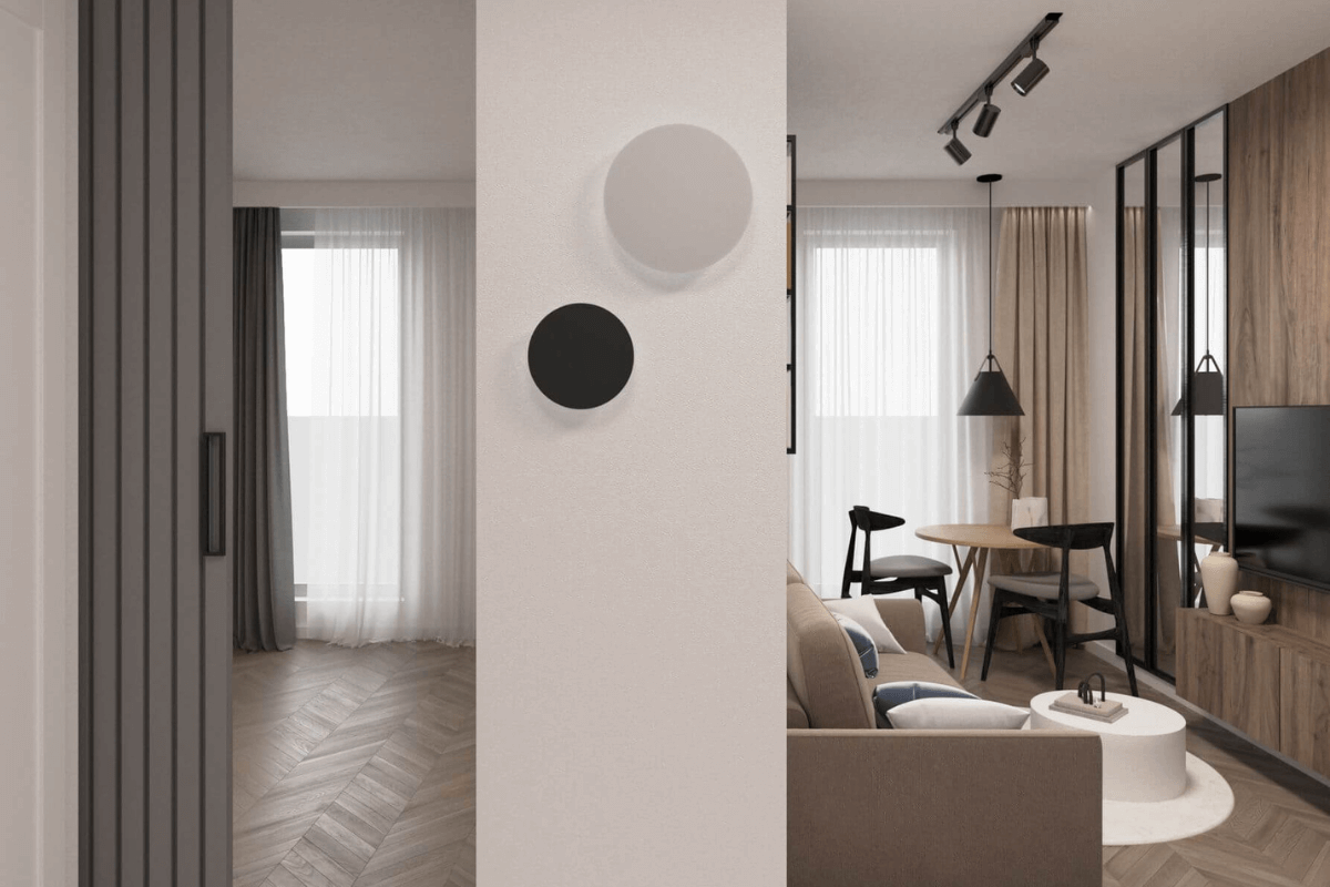 Wnętrze minimalistycznego salonu z jasnymi ścianami i drewnianymi meblami
