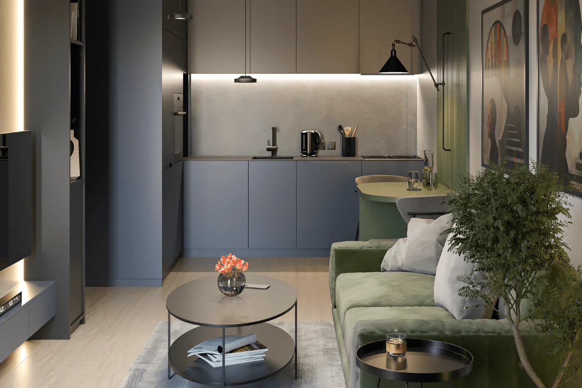Nowoczesne wnętrze kuchni z szarymi meblami, zieloną sofą i industrialnymi akcentami.