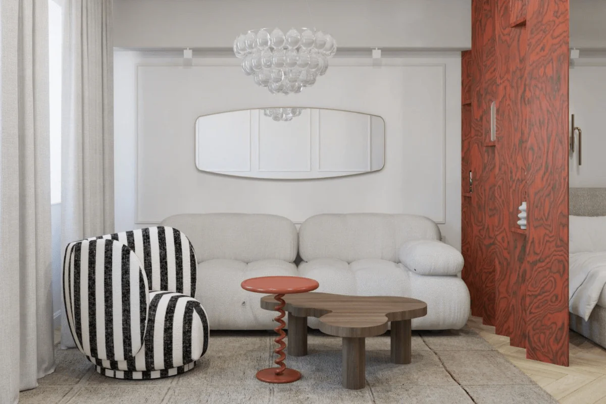 Wnętrze salonu w stylu art deco i tradycyjnym z białą sofą i czerwonym stolikiem.