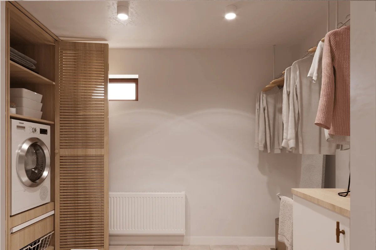 Pralnia z minimalistycznymi, nowoczesnymi szafkami i białymi sprzętami.