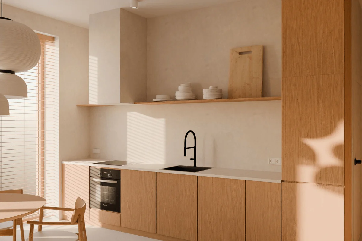 Wnętrze kuchni w stylu japandi z drewnianymi meblami i białymi elementami.