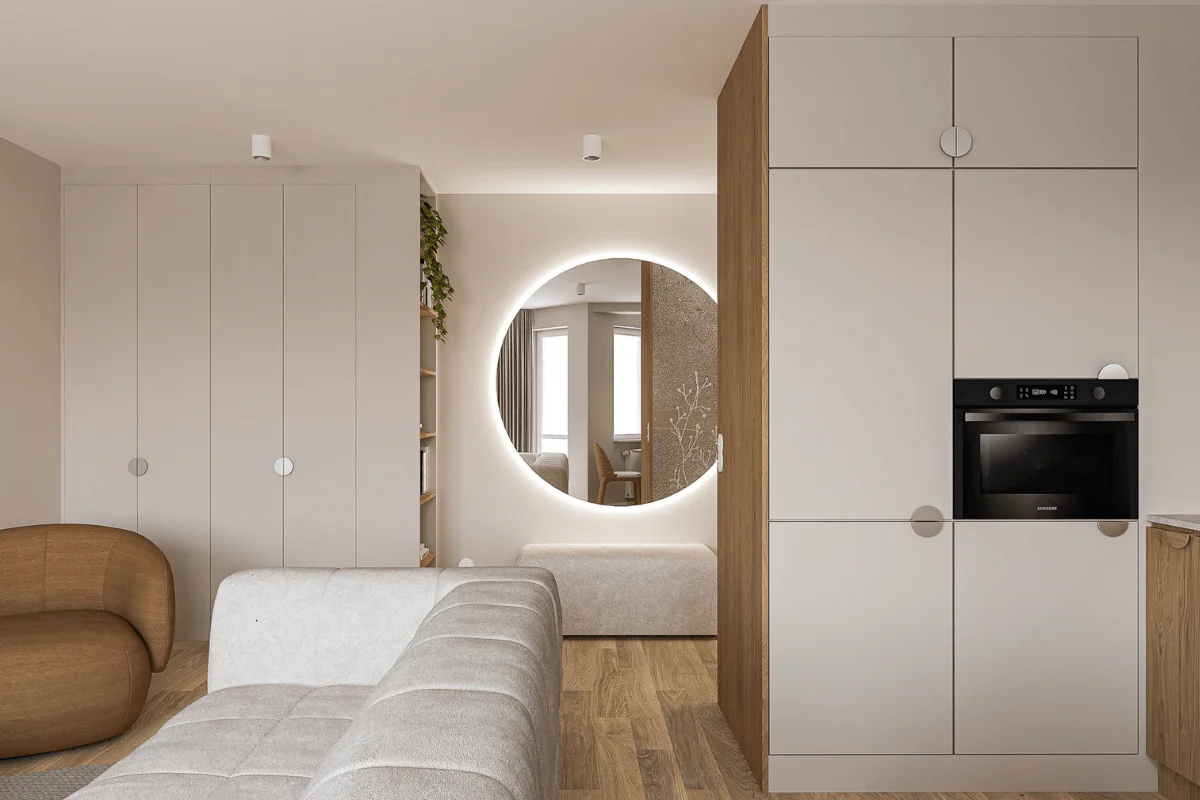 Wnętrze w stylu boho i japandi z jasnymi meblami, okrągłym lustrem oraz drewnianymi akcentami.