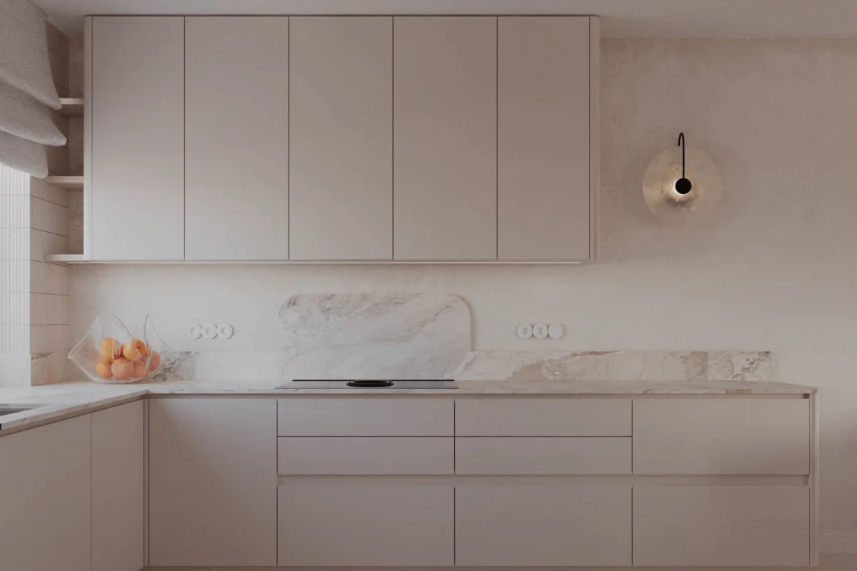 Nowoczesna kuchnia z jasnymi meblami i marmurowym blatem, idealna do gotowania.