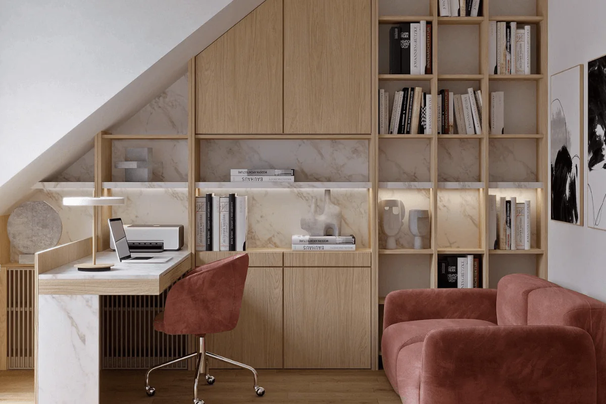 Nowoczesny gabinet z biurkiem, regałem na książki i różowym fotelem.