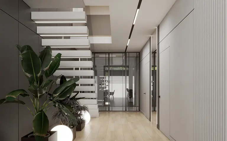 Minimalistyczny przedpokój z roślinami, nowoczesne schody, szare ściany.