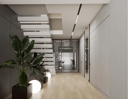 Minimalistyczny przedpokój z roślinami, nowoczesne schody, szare ściany.