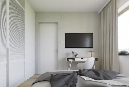 Wnętrze sypialni w stylu japandi i minimalistycznym, z szarymi ścianami i nowoczesnymi meblami.