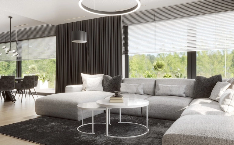 Wnętrze salonu z szarym narożnikiem i białymi dodatkami, minimalistyczny i nowoczesny design.