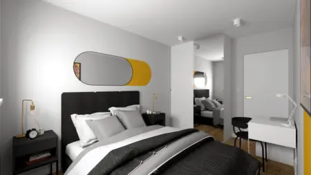 Sypialnia w stylu minimalistycznym z czarnym łóżkiem i szarymi detalami, rustykalne akcenty.