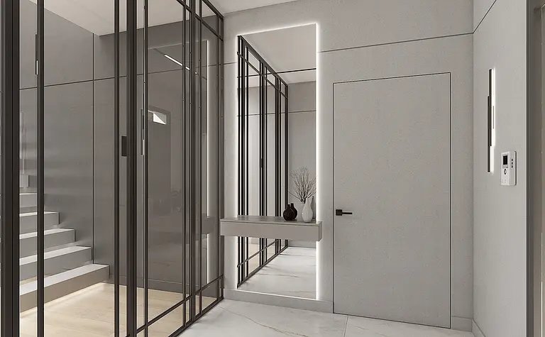 Nowoczesny przedpokój z szarymi ścianami i minimalistycznymi detalami.