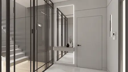 Nowoczesny przedpokój z szarymi ścianami i minimalistycznymi detalami.