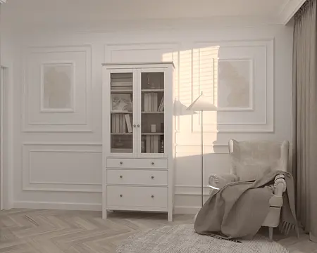 Wnętrze salonu z białą witryną, szarym fotelem i nowoczesnym stylem quiet luxury.