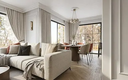 Wnętrze salonu z jasnym narożnikiem, okrągłym stołem i dużymi oknami, styl quiet luxury