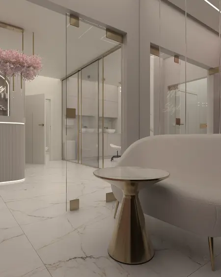 Nowoczesne wnętrze glamour z jasnymi meblami i złotymi detalami.
