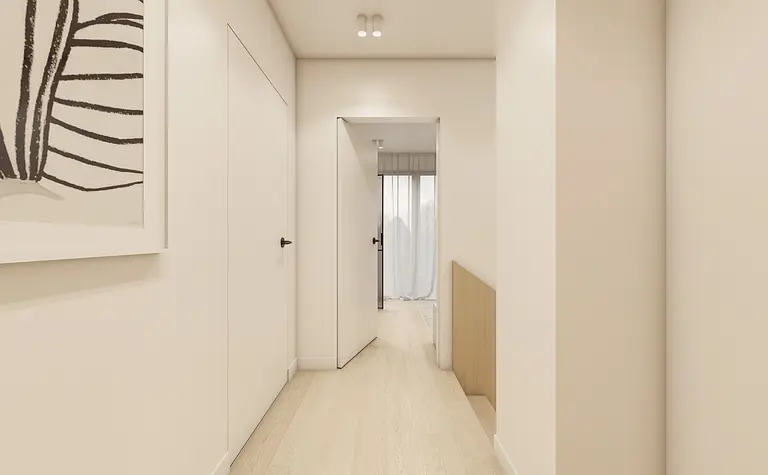 Przedpokój w stylu japandi i minimalistycznym z jasnymi ścianami i drewnianą podłogą.