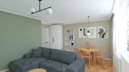 Wnętrze salonu w stylu boho i minimalistycznym z zieloną kanapą i drewnianym stołem.