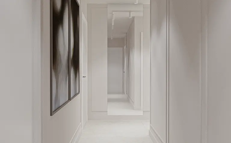 Przedpokój w stylu minimalistycznym z białymi ścianami i oświetleniem sufitowym.