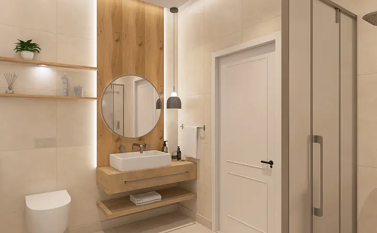 Nowoczesna łazienka z drewnianymi akcentami, okrągłym lustrem i minimalistycznym wyposażeniem.