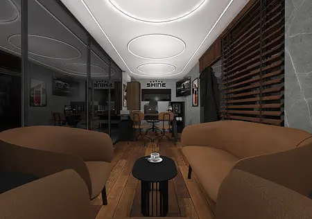 Wnętrze biura w stylu dopamine decor, industrialnym i japandi z brązowymi sofami.