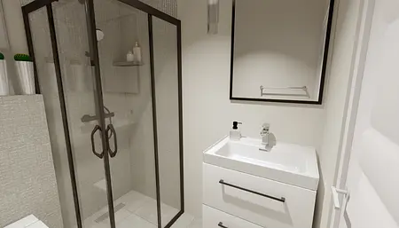 Nowoczesna łazienka z przeszkloną kabiną prysznicową i białymi meblami.