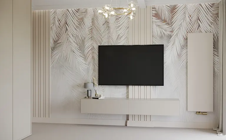 Minimalistyczne wnętrze z telewizorem na ścianie i jasnymi meblami.