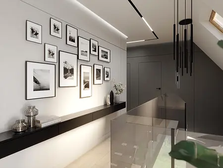 Przedpokój w minimalistycznym stylu z czarnymi detalami i zdjęciami na ścianie.