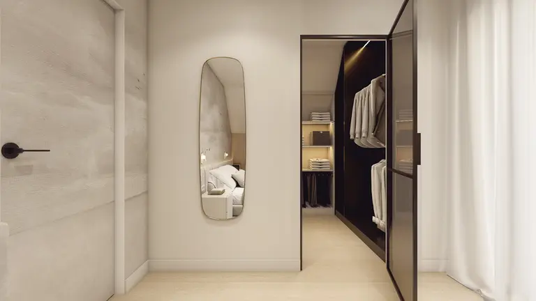 Garderoba w stylu japandi i minimalistycznym z lustrami i białymi meblami.