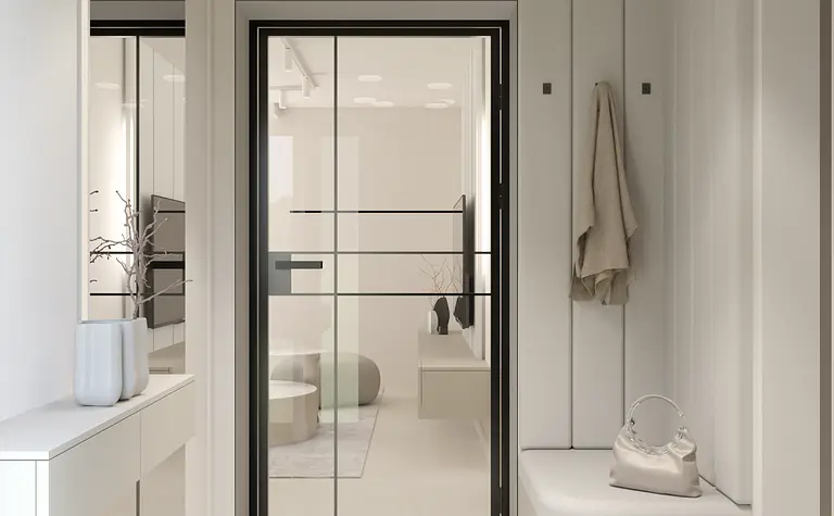 Przedpokój w minimalistycznym stylu z białymi ścianami i nowoczesnymi meblami.