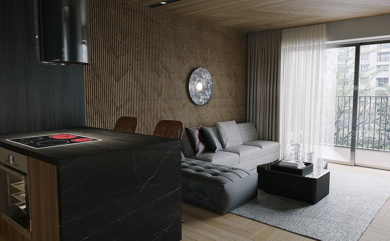 Nowoczesny salon z szarymi meblami, czarną wyspą i drewnianymi akcentami.