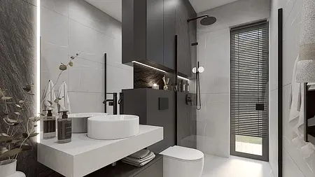 Nowoczesna łazienka z minimalistycznym designem, szarymi płytkami i czarnymi elementami.