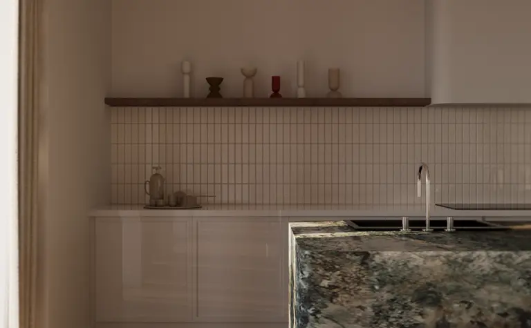 Wnętrze kuchni w stylu skandynawskim z białymi meblami i zielonym blatem.