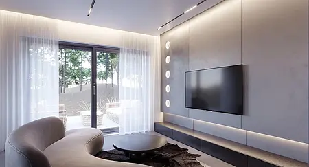 Wnętrze salonu z telewizorem, minimalistycznymi meblami i dużym oknem.