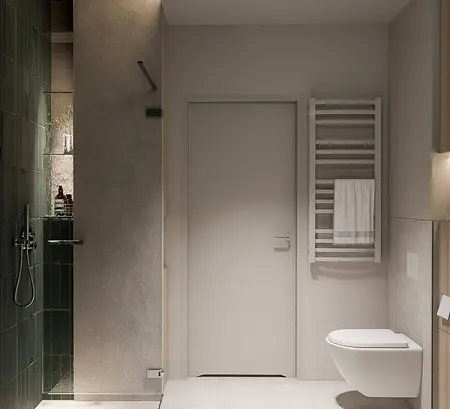 Wnętrze nowoczesnej łazienki z zieloną płytką, minimalistycznymi detalami i soft minimalizmem.