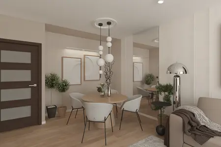 Wnętrze jadalni z okrągłym stołem, nowoczesnymi krzesłami i roślinami w stylu minimaluxe.