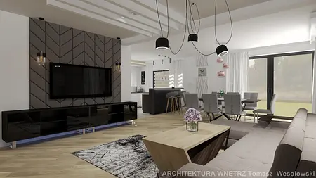 Współczesny salon z szaro-białą ścianą i drewnianym stołem oraz nowoczesnymi lampami.