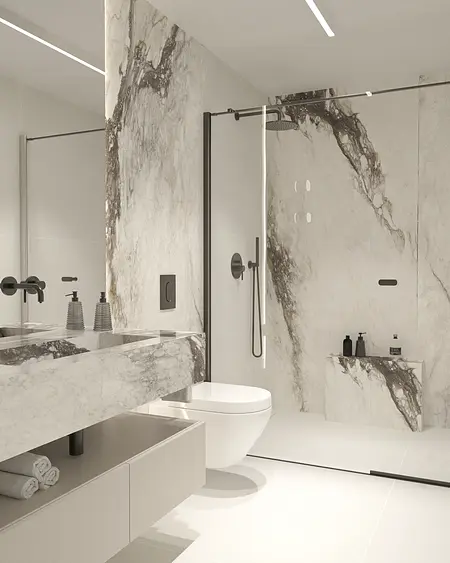Wnętrze nowoczesnej łazienki z marmurowymi ścianami i minimalistycznym wystrojem