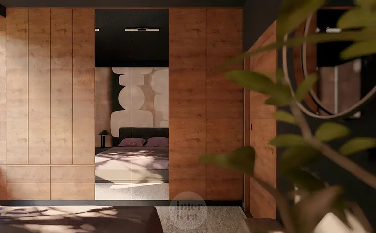 Wnętrze garderoby z eklektycznymi detalami, drewnianymi szafkami i minimalistycznym lustrem.