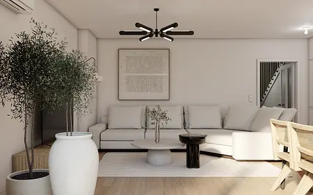 Wnętrze salonu z eklektycznym i nowoczesnym designem, jasna sofa i czarne akcenty.