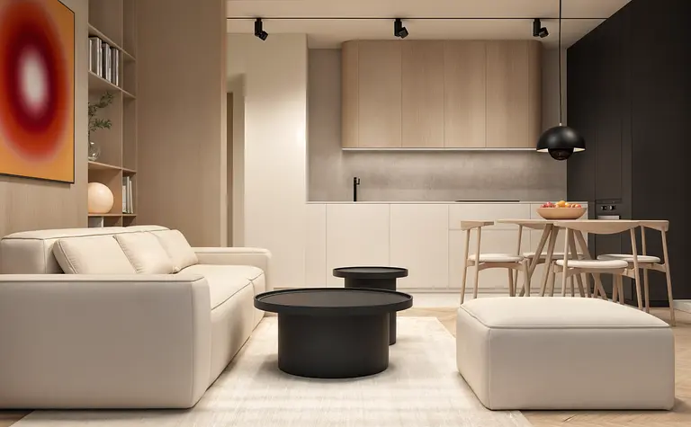 Wnętrze salonu w stylu nowoczesnym i japandi z beżową sofą i czarnymi akcentami.