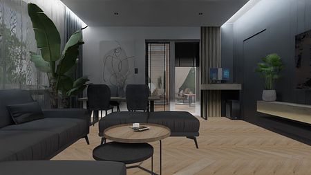 Nowoczesny salon z ciemnymi meblami, drewnianą podłogą i roślinami.
