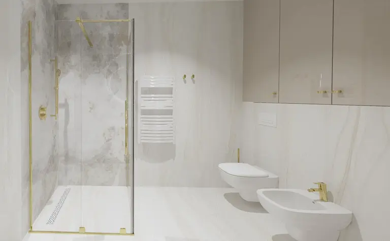 Nowoczesna łazienka z prysznicem, białymi meblami i złotymi detalami