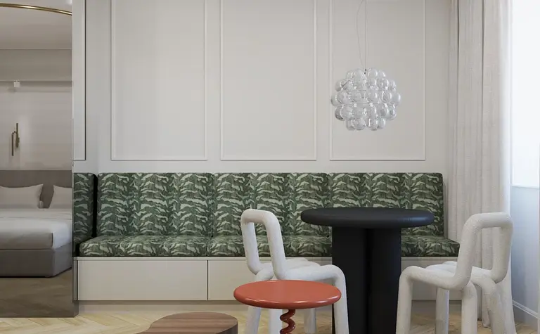 Wnętrze jadalni z zieloną kanapą, czarnym stołem i lampą w stylu art deco i tradycyjnym.