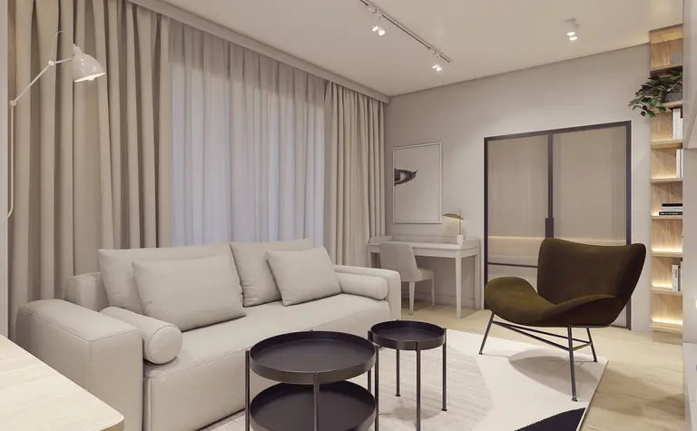 Wnętrze salonu z eklektycznym i nowoczesnym designem, beżowa sofa, czarne stoliki.