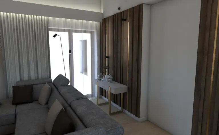 Wnętrze nowoczesnego salonu z szaro-brązową sofą i białymi detalami.