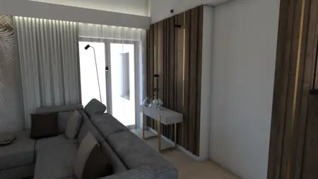 Wnętrze nowoczesnego salonu z szaro-brązową sofą i białymi detalami.