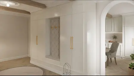 Garderoba w stylu tradycyjnym z białymi meblami i złotymi detalami.