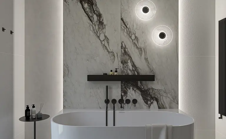 Nowoczesna łazienka z minimalistycznym designem, białą wanną i marmurową ścianą.