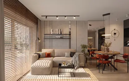 Wnętrze minimalistycznego salonu z beżową sofą i drewnianym stołem.