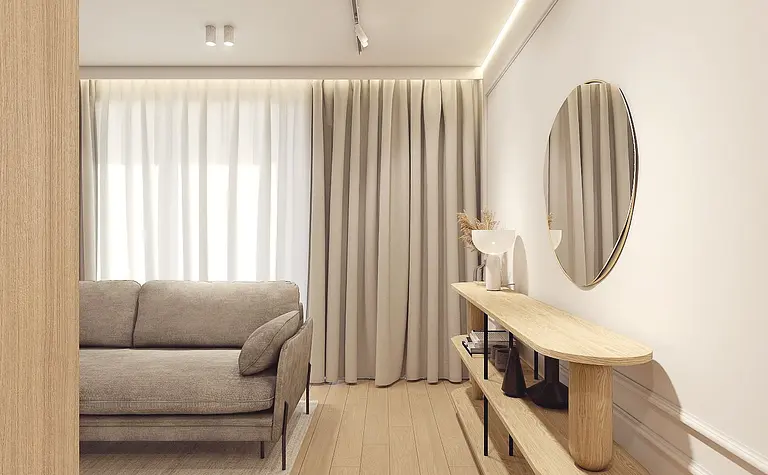Nowoczesny salon w minimalistycznym stylu z szarymi meblami i białymi akcentami.